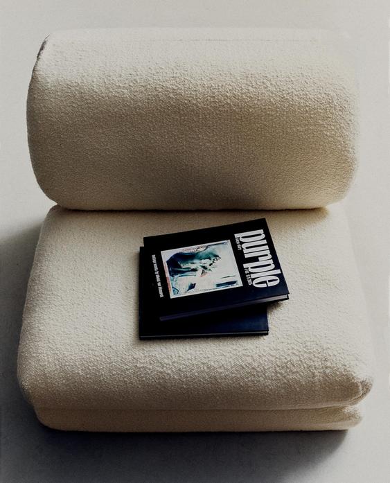 FOLDING BOUCLÉ ARMCHAIR