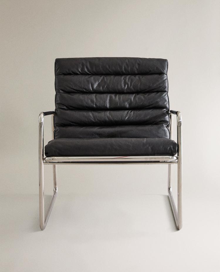 LEATHER AND STAINLESS STEEL ACCENT CHAIR