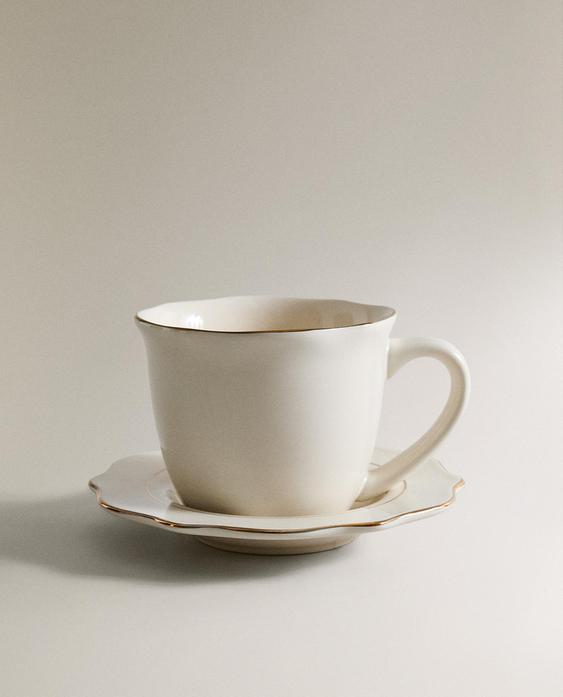 PORCELAIN TEACUP AND SAUCER WITH RIM DETAIL