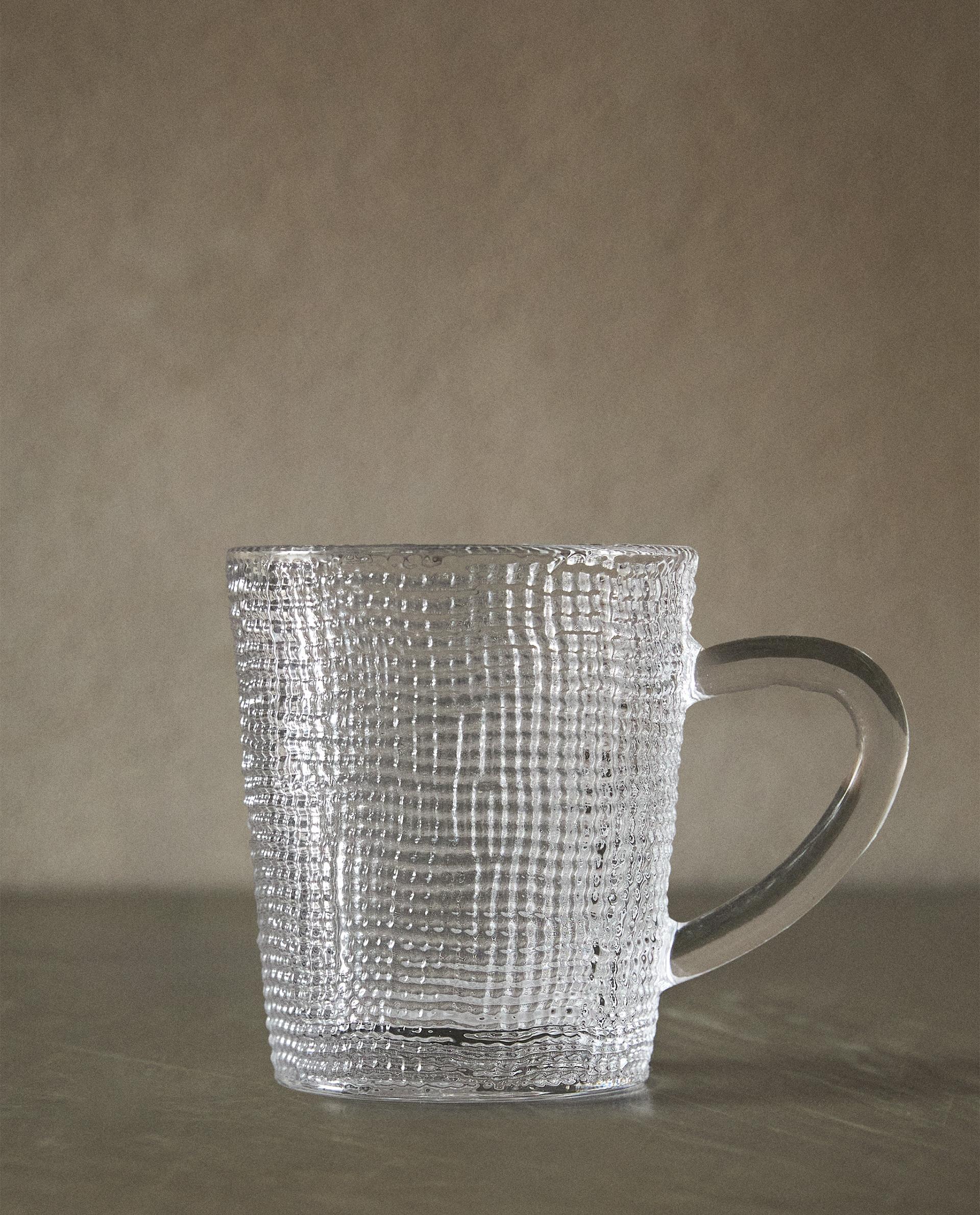 GLASS CUP WITH RAISED DESIGN