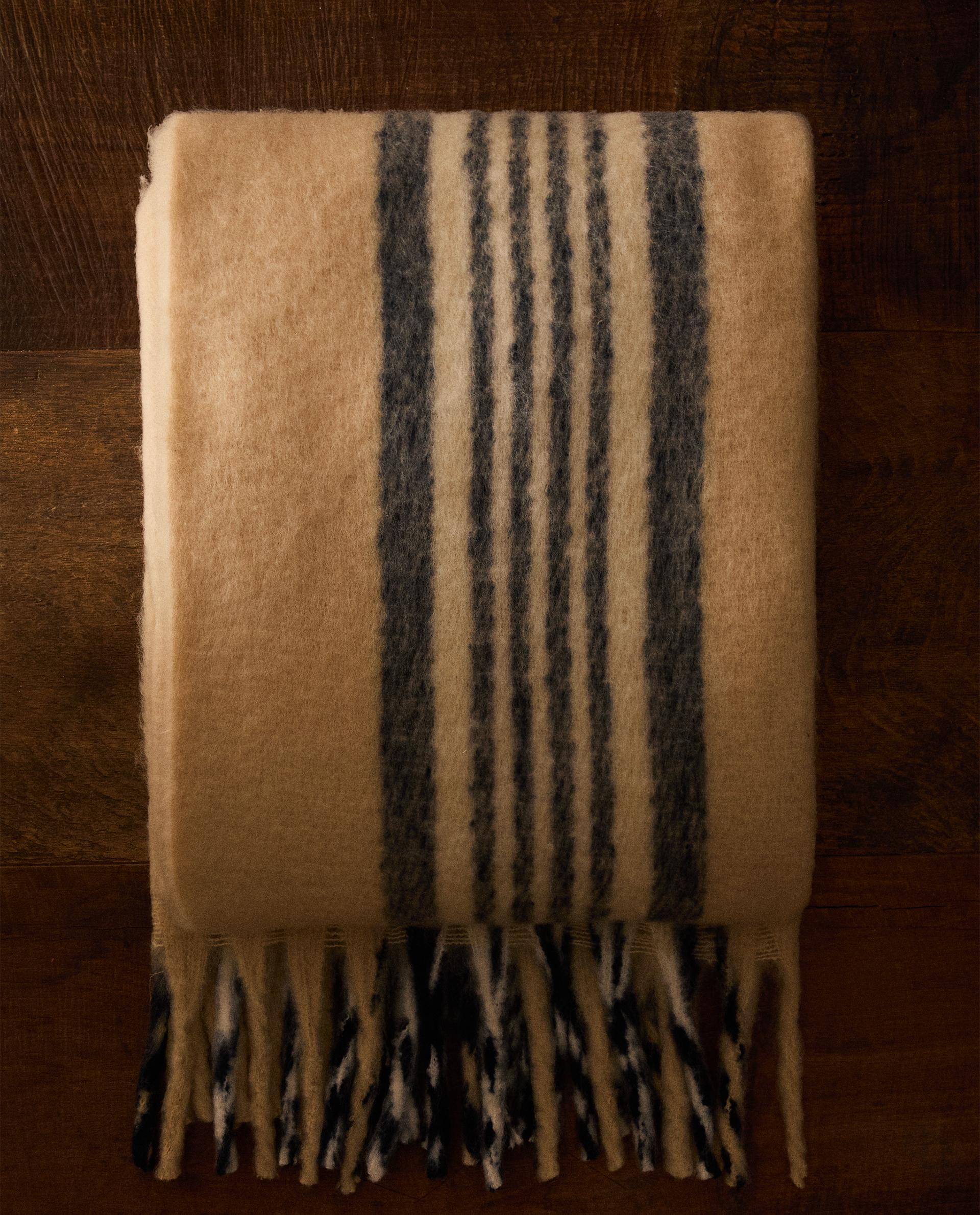 BRUSHED THROW WITH CENTRAL STRIPES AND FRINGING