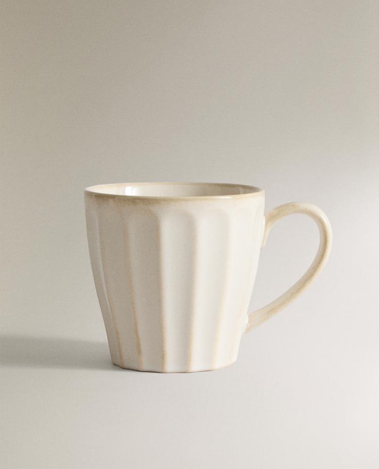 STONEWARE MUG WITH RAISED DESIGN