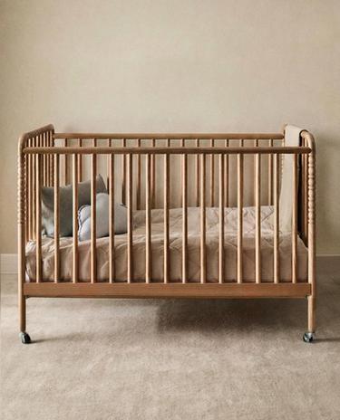 CARVED WOODEN COT WITH WHEELS