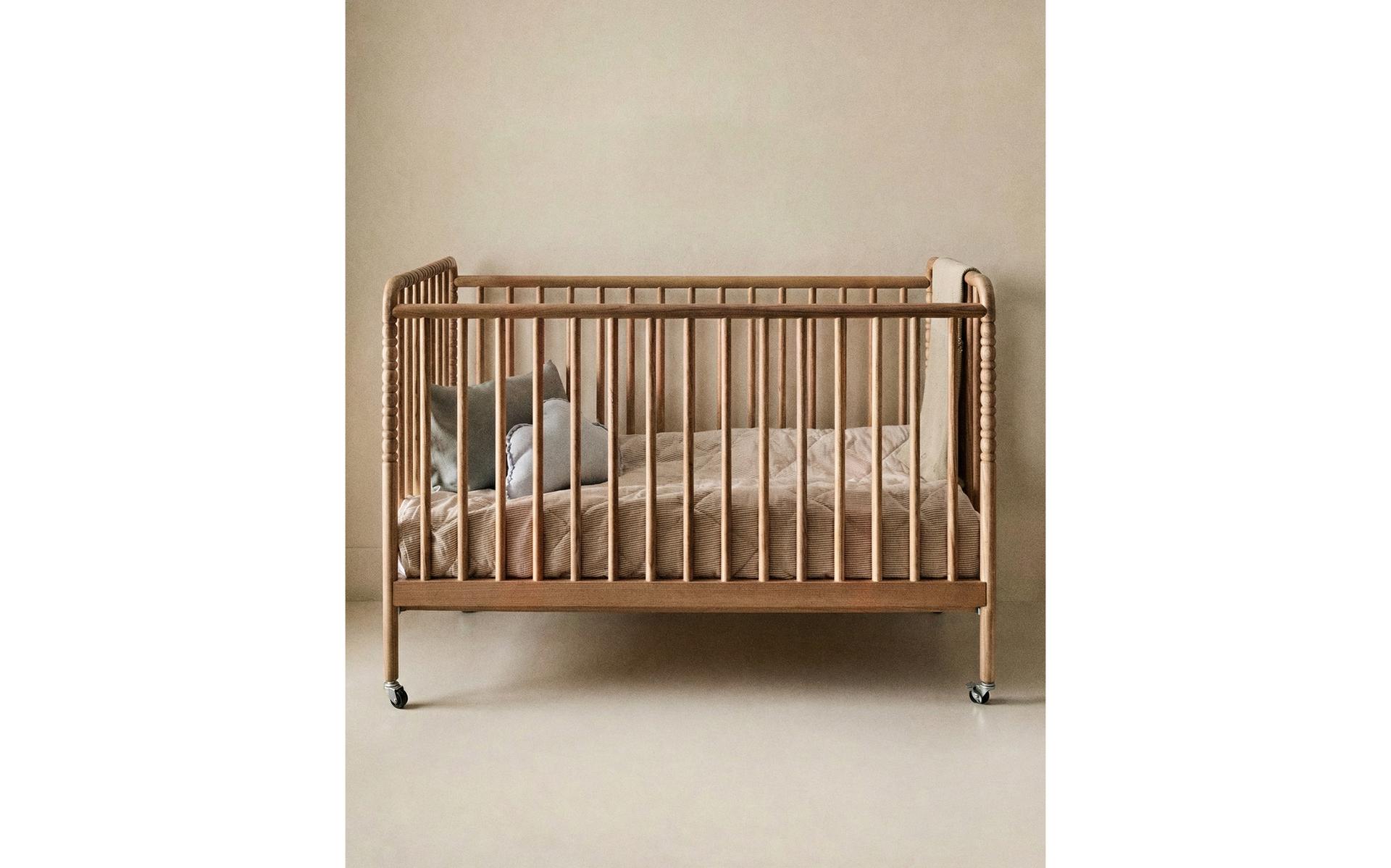 CARVED WOODEN COT WITH WHEELS CARVED WOODEN COT WITH WHEELS