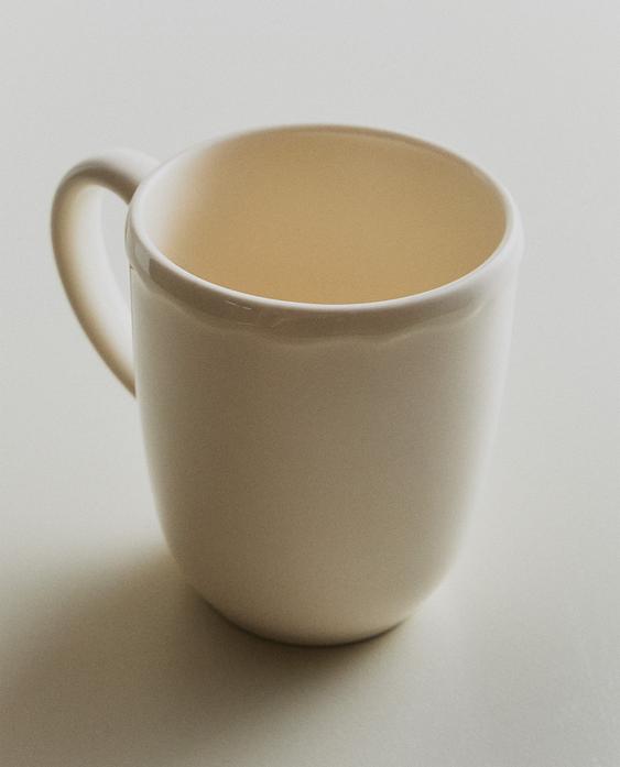 EARTHENWARE MUG WITH A RAISED-DESIGN EDGE EARTHENWARE MUG WITH A RAISED-DESIGN EDGE