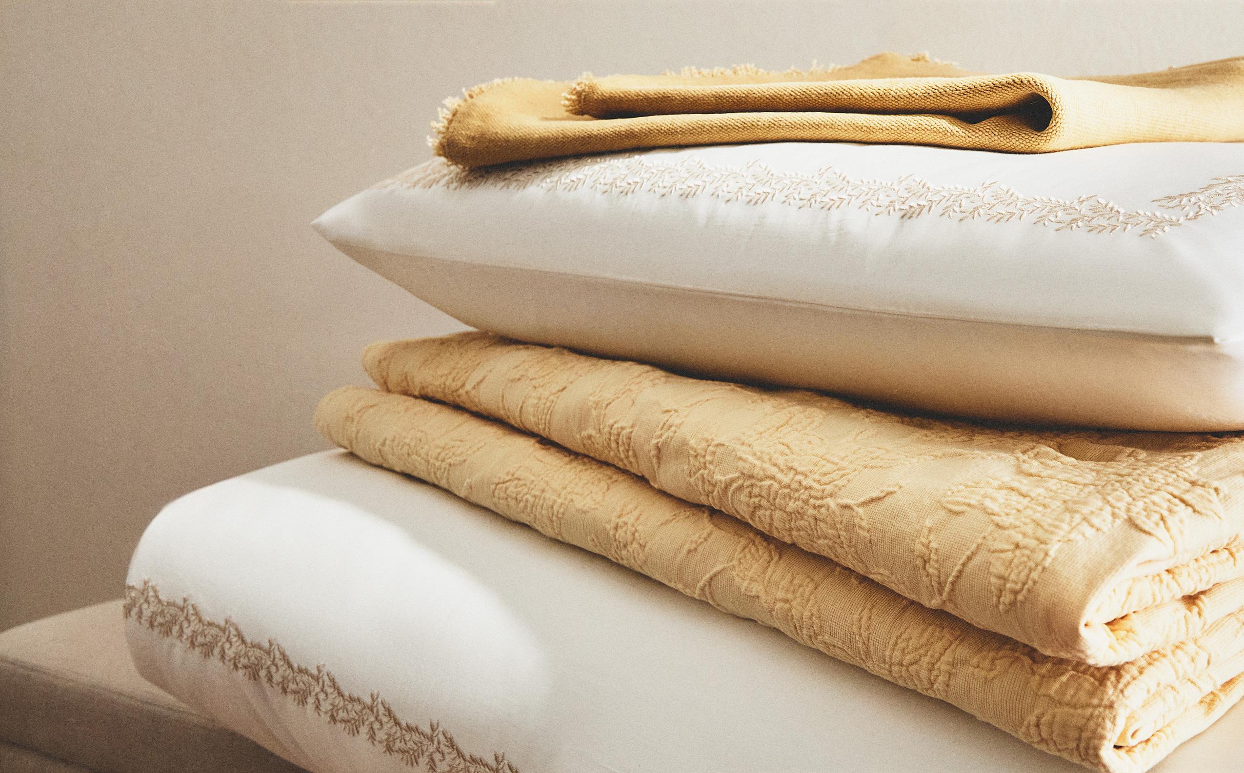 THROWS AND CUSHION COVERS