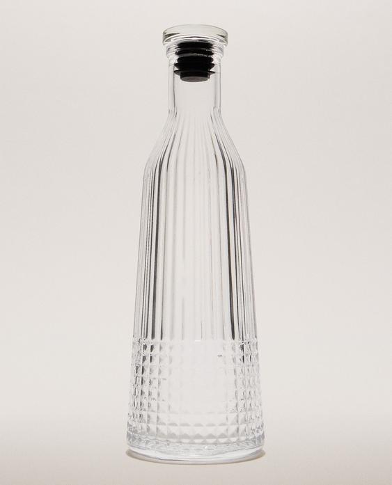 GLASS BOTTLE WITH RELIEF DESIGN GLASS BOTTLE WITH RELIEF DESIGN
