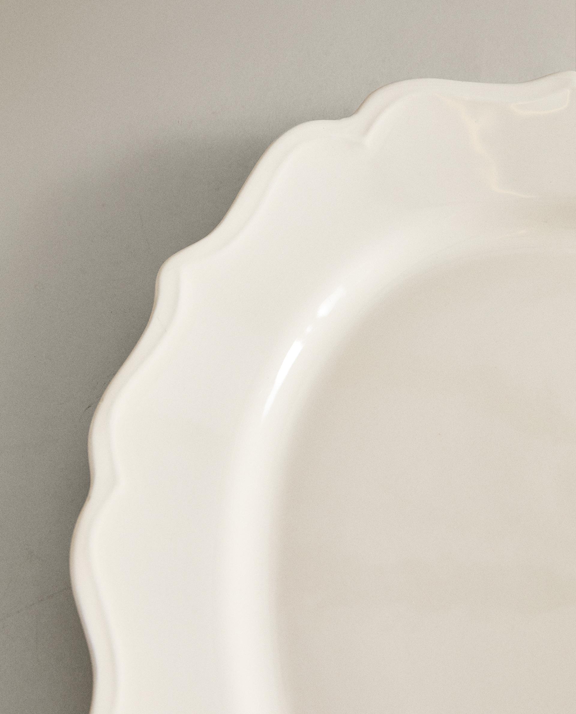 EARTHENWARE SERVING DISH WITH RAISED-DESIGN EDGE