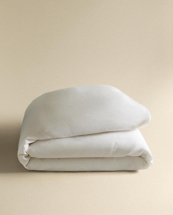 PÅSLAKAN I LINNE MED HÅLSÖM PÅSLAKAN I LINNE MED HÅLSÖM