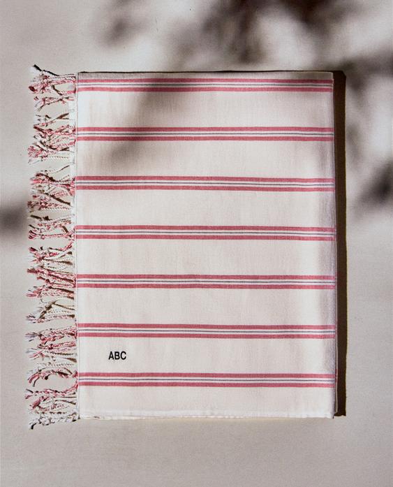 مخططة للف منشفة شاطئ