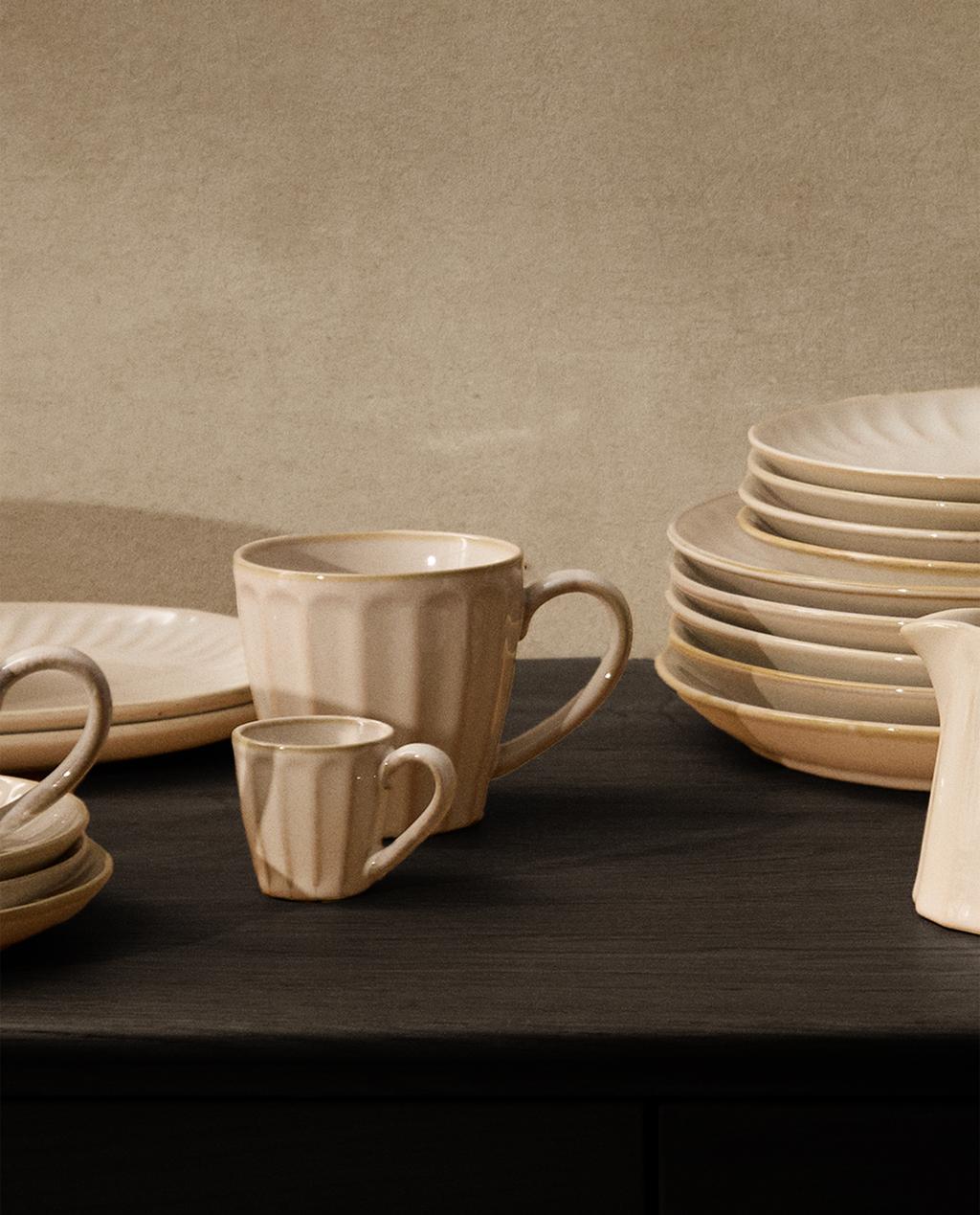 STONEWARE TABLEWARE WITH RAISED DESIGN