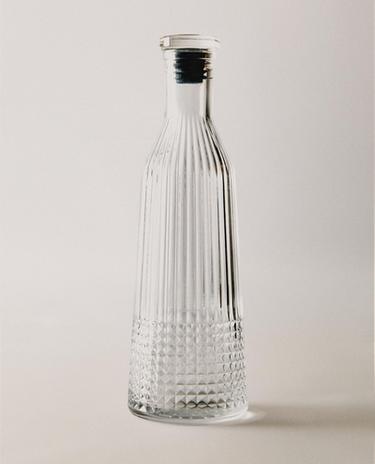 GLASS BOTTLE WITH RELIEF DESIGN