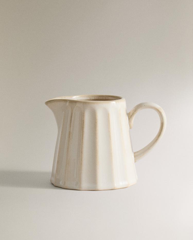 STONEWARE MILK JUG WITH RAISED DESIGN