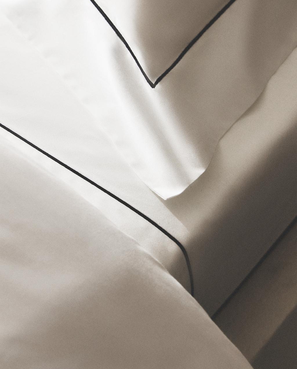 SATIN-OBERLAKEN MIT BOGENKANTE