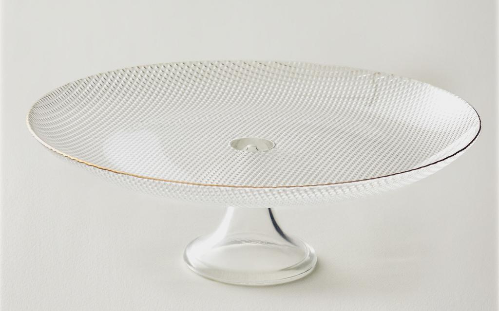 Glass cake serving dish with stem and relief rim