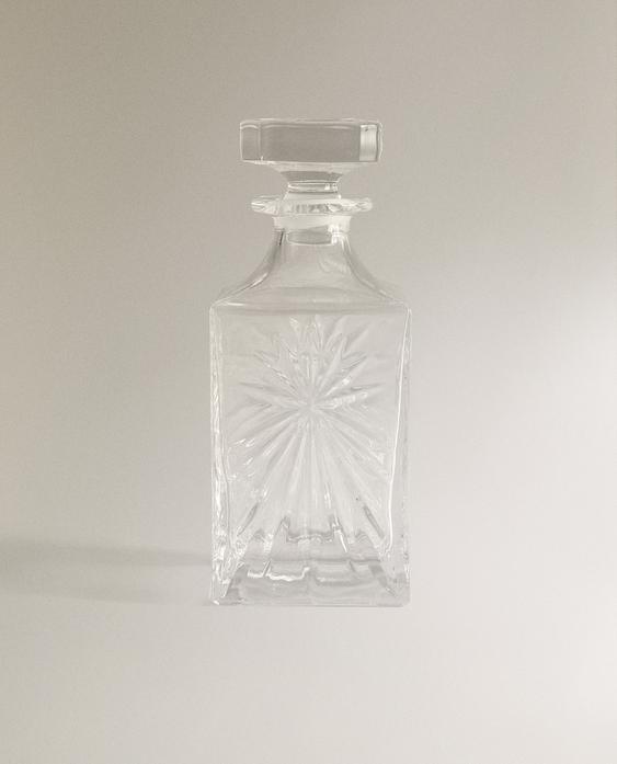 CRYSTALLINE BOTTLE WITH RAISED DESIGN
