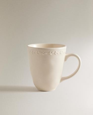 EARTHENWARE MUG WITH RAISED-DESIGN EDGE