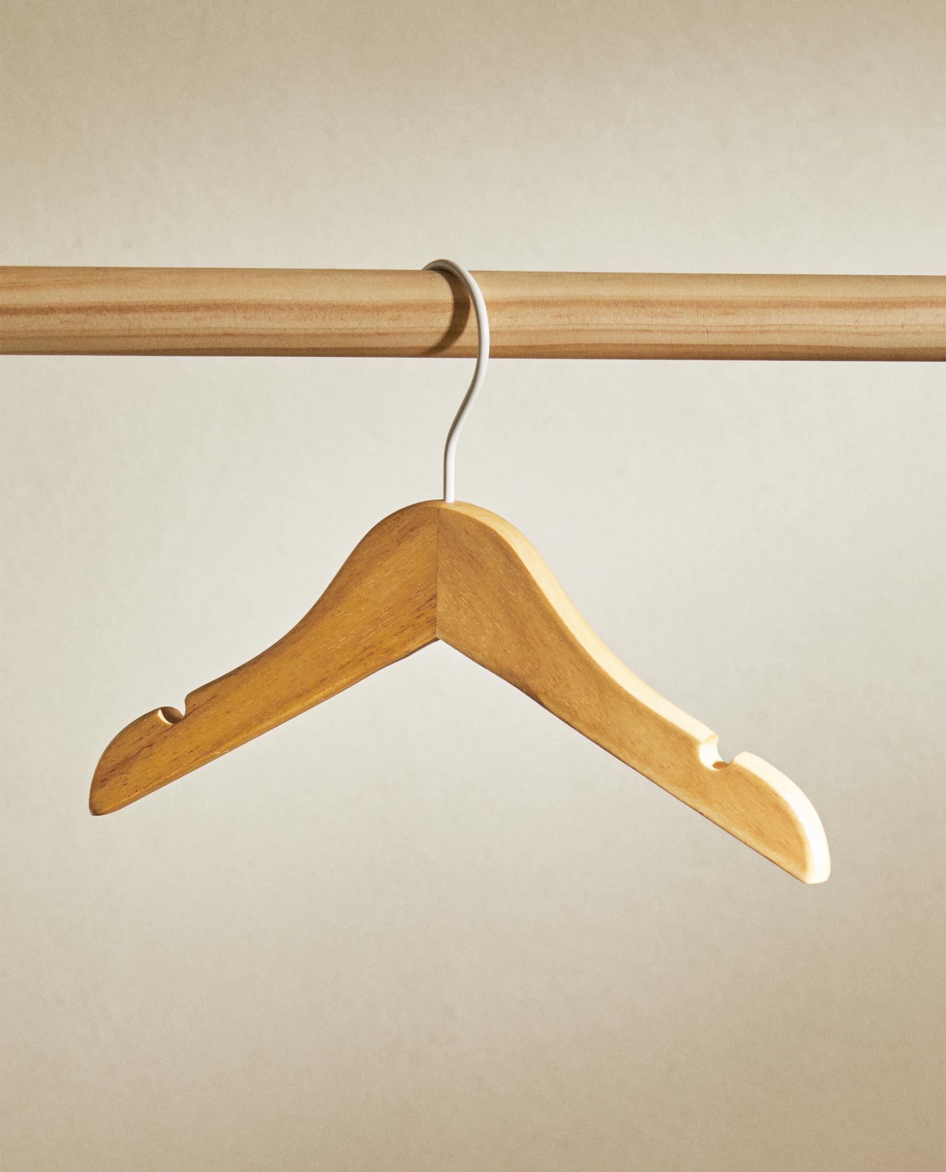 Wooden hangers for baby clothes sale