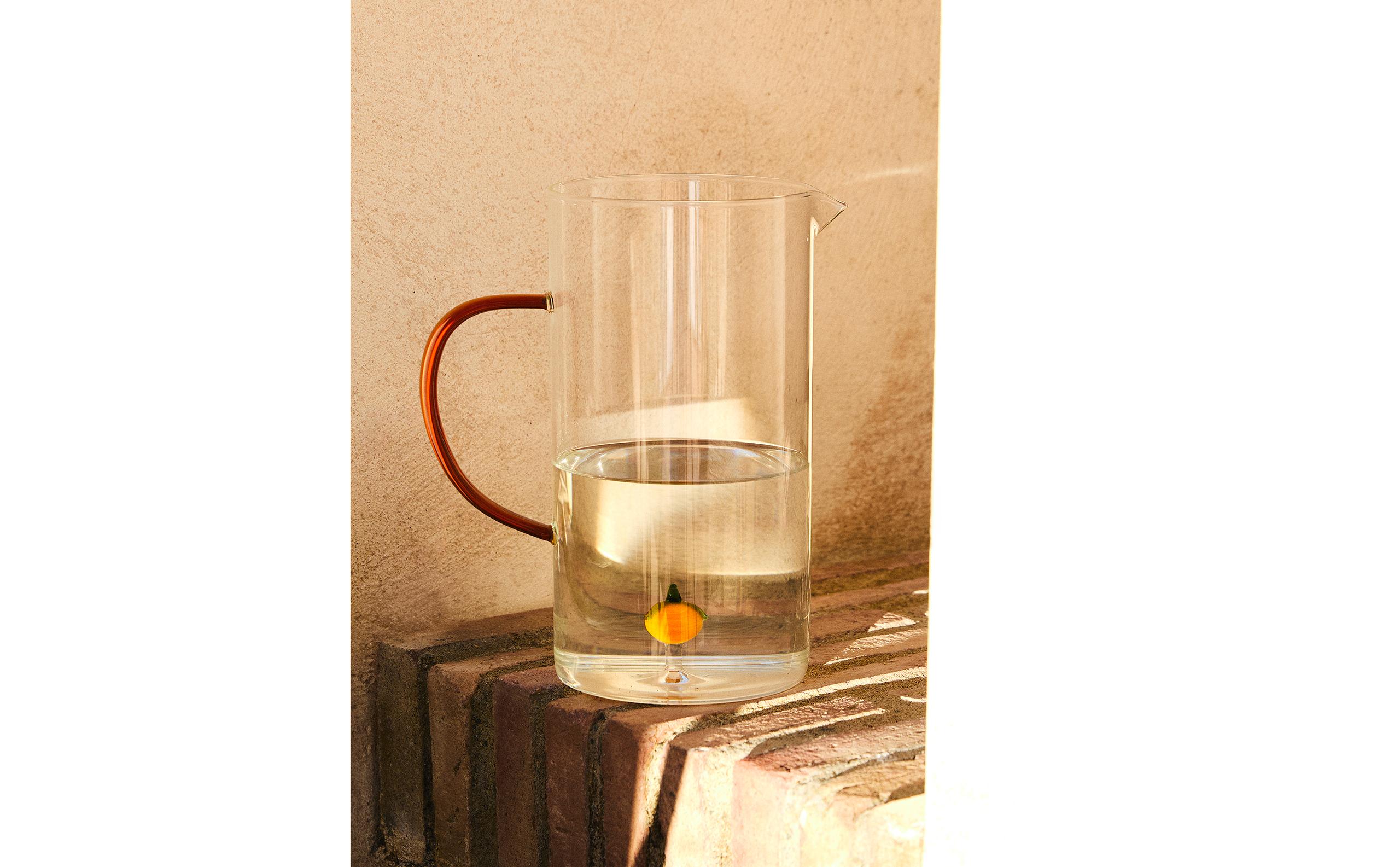 ORANGE GLASS JUG WITH HANDLE