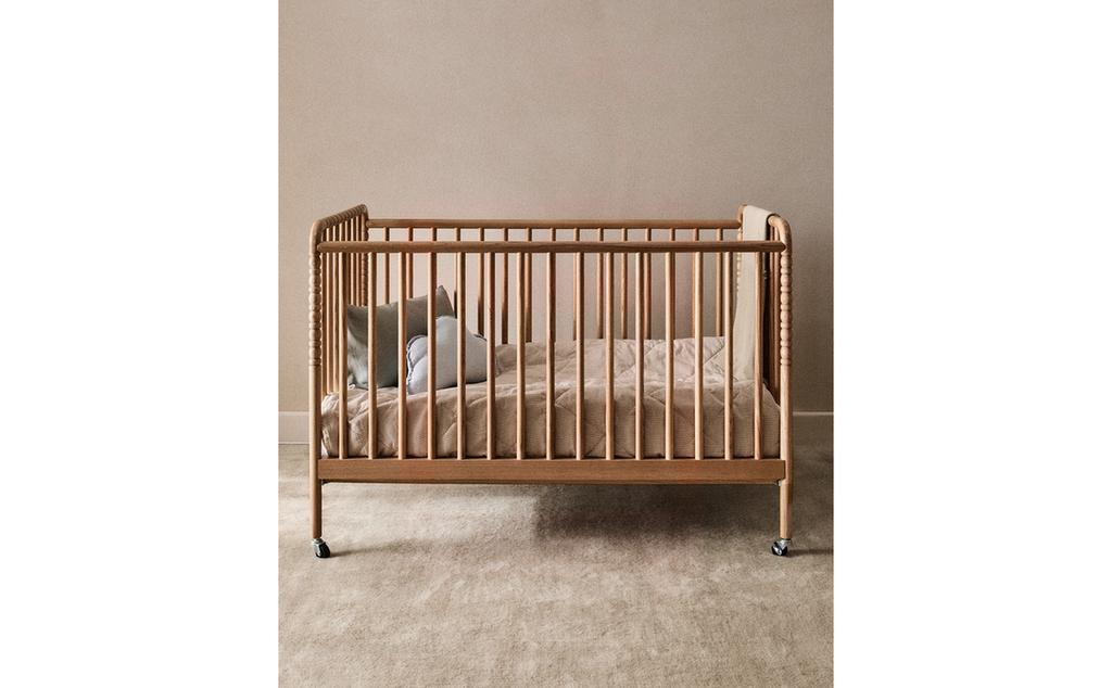 CARVED WOODEN COT WITH WHEELS CARVED WOODEN COT WITH WHEELS