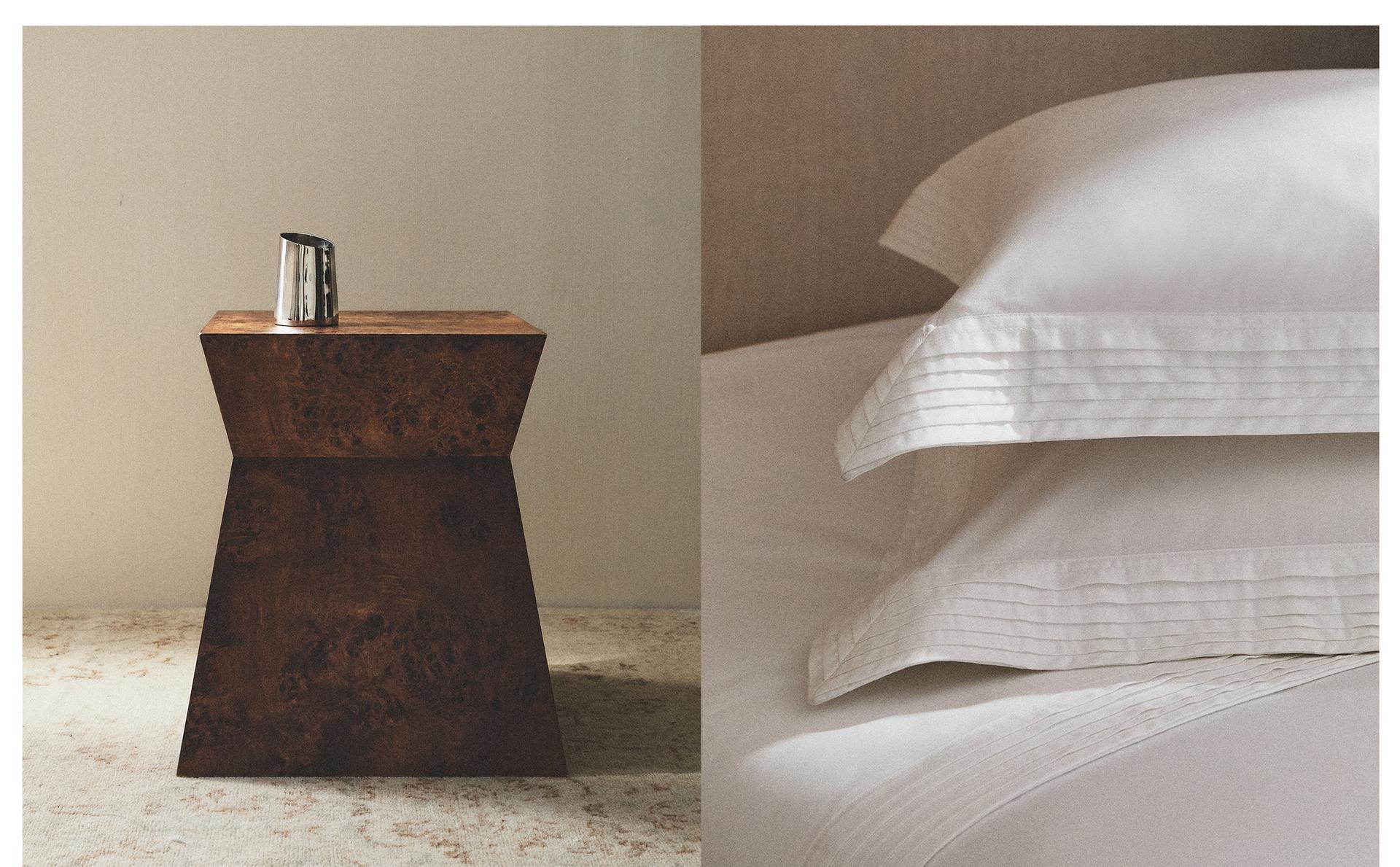 GEOMETRIC ROOT WOOD TABLE, SATEEN BED LINEN AND METAL VASE GEOMETRIC ROOT WOOD TABLE, SATEEN BED LINEN AND METAL VASE